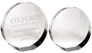 CLEAR GLASS ROUND WEDGED PAPERWEIGHT