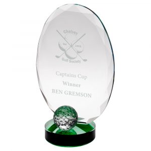 CLEAR GLASS OVAL AND GOLF BALL WITH GREEN HIGHLIGHTS